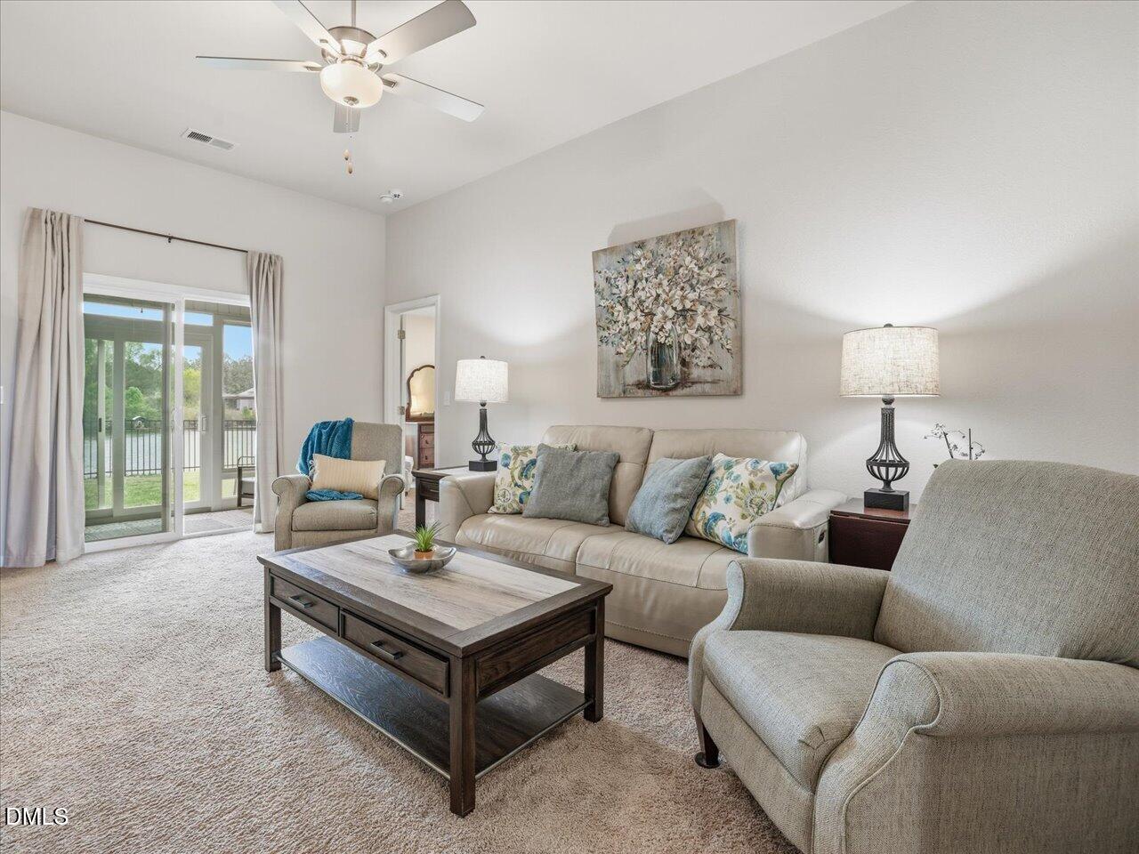 90 Barnsley Road Angier, NC 27501 - Photo 8 of 40 a living room with furniture and a large window
