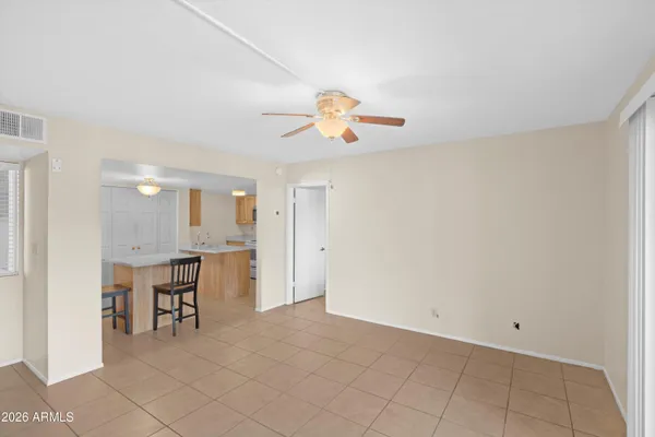 a view of kitchen with furniture and a chandelier