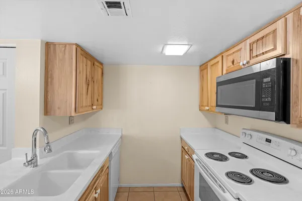 a bathroom with a sink and a microwave