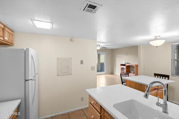 a bedroom with a bed and a sink