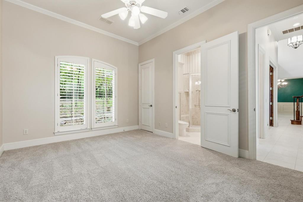 970 Crystal Cove Oak Point, TX 75068 - Photo 26 of 40 an empty room with chandelier fan