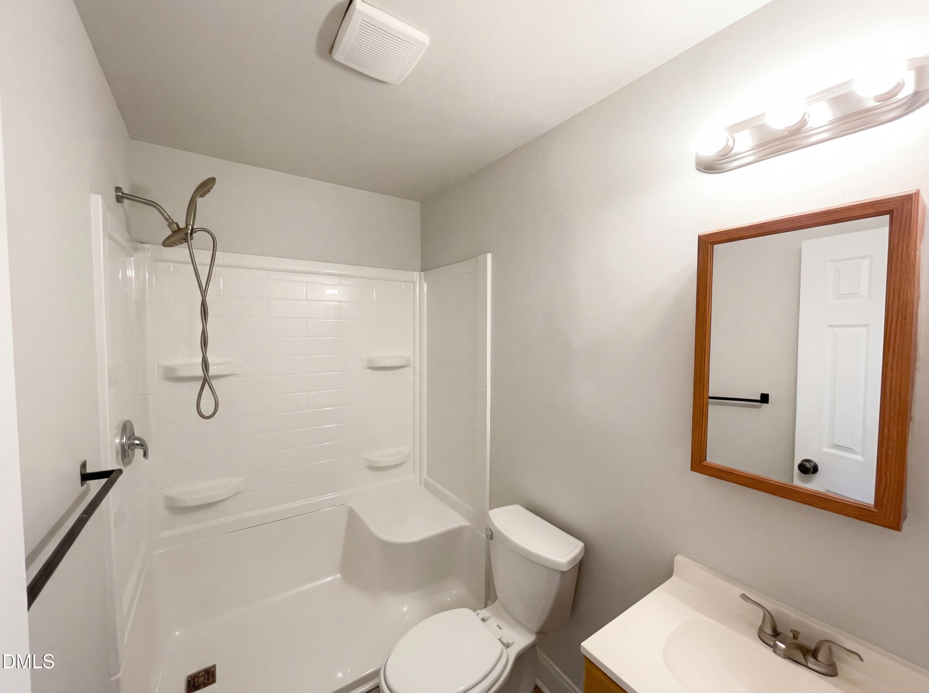 6412 Rock Quarry Road Raleigh, NC 27610 - Photo 13 of 17 a bathroom with a toilet sink and shower