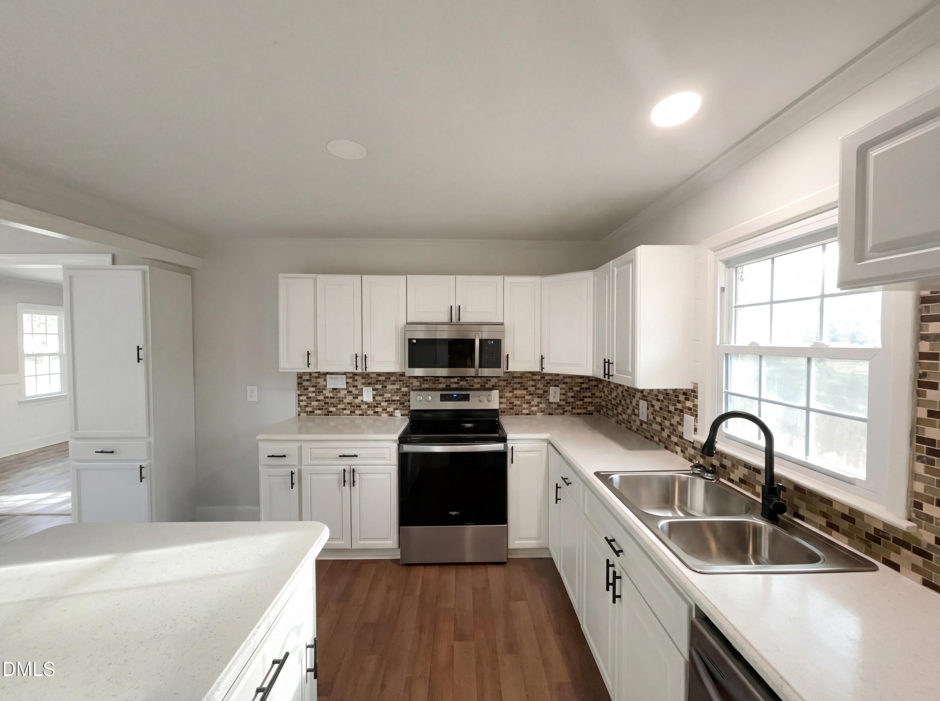 6412 Rock Quarry Road Raleigh, NC 27610 - Photo 5 of 17 a kitchen with stainless steel appliances granite countertop a sink stove and refrigerator