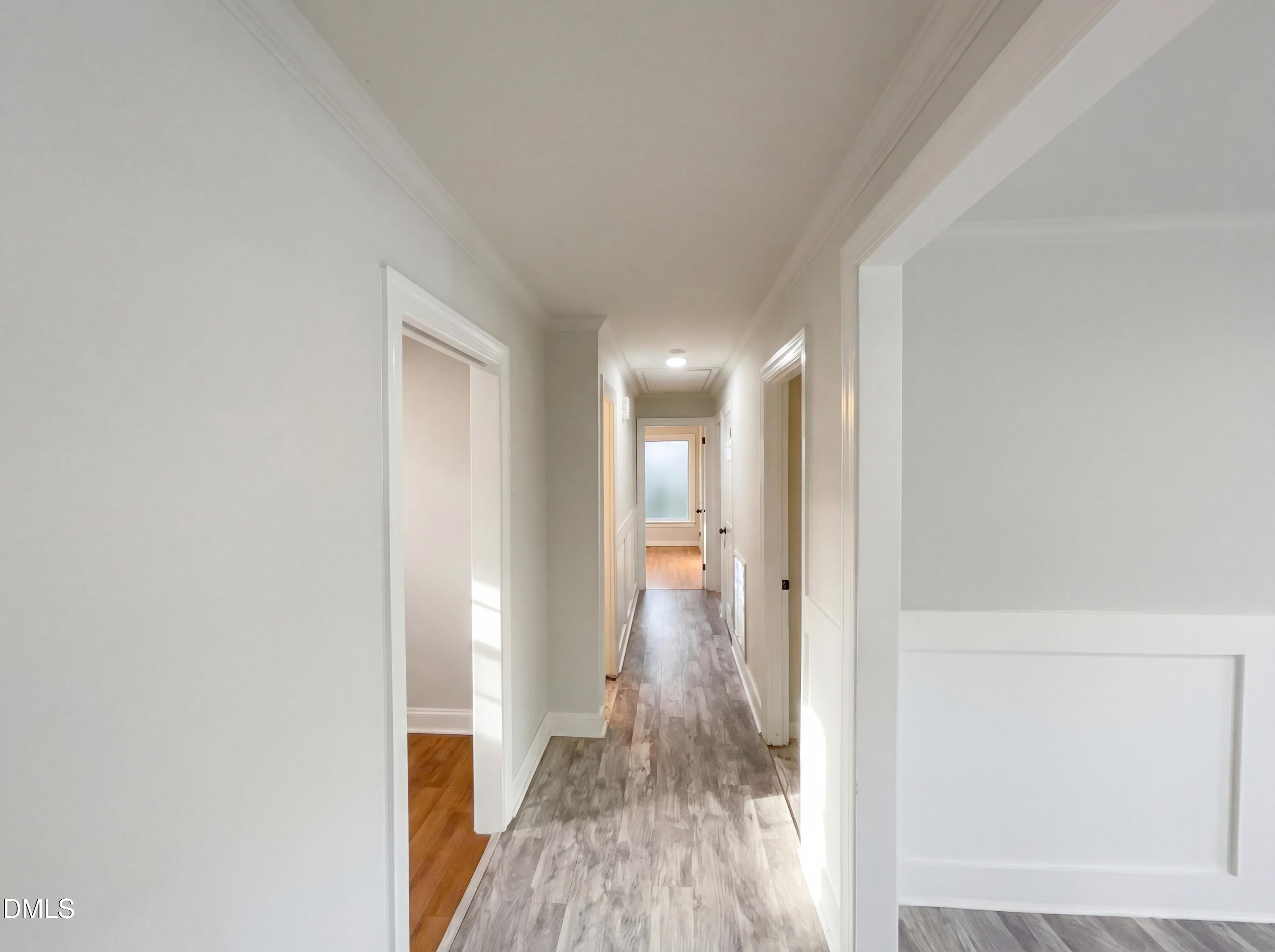 6412 Rock Quarry Road Raleigh, NC 27610 - Photo 7 of 17 a view of hallway with wooden floor