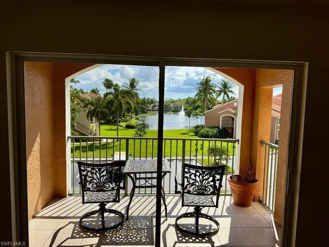 a view of a chairs and table in backyard