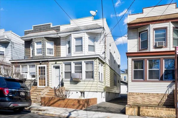 a front view of a building with glass windows