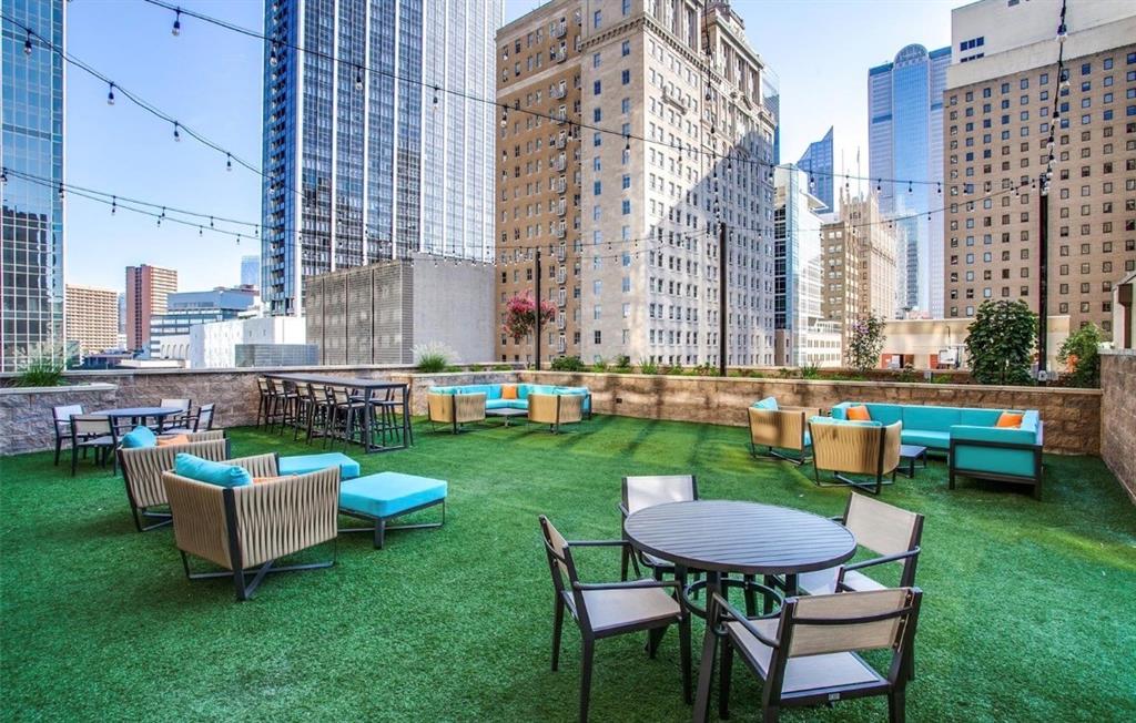1200 Main Street, Unit 1404 Dallas, TX 75202 - Photo 19 of 26 a view of a chairs and table in backyard of the house