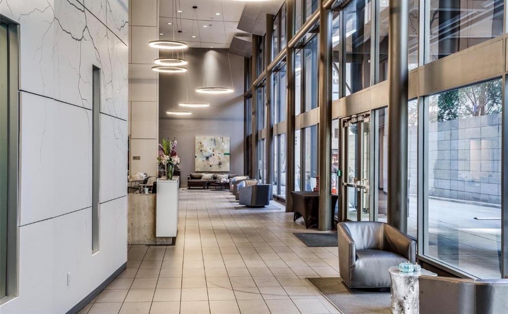 1200 Main Street, Unit 1404 Dallas, TX 75202 - Photo 24 of 27 a view of a lobby with a couch and chairs