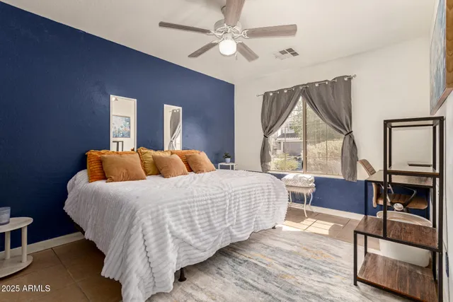 a bed room with a bed and a window