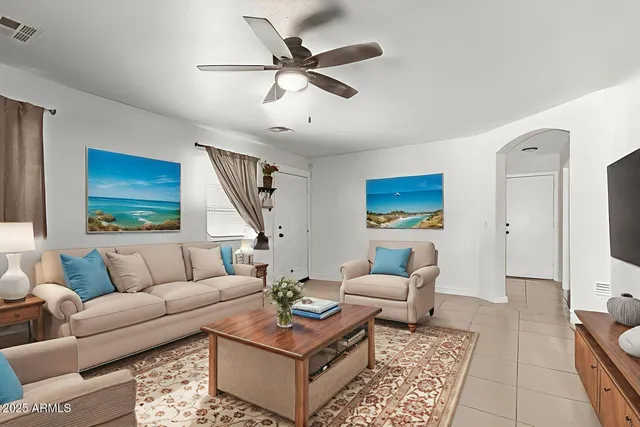 a living room with furniture and a rug