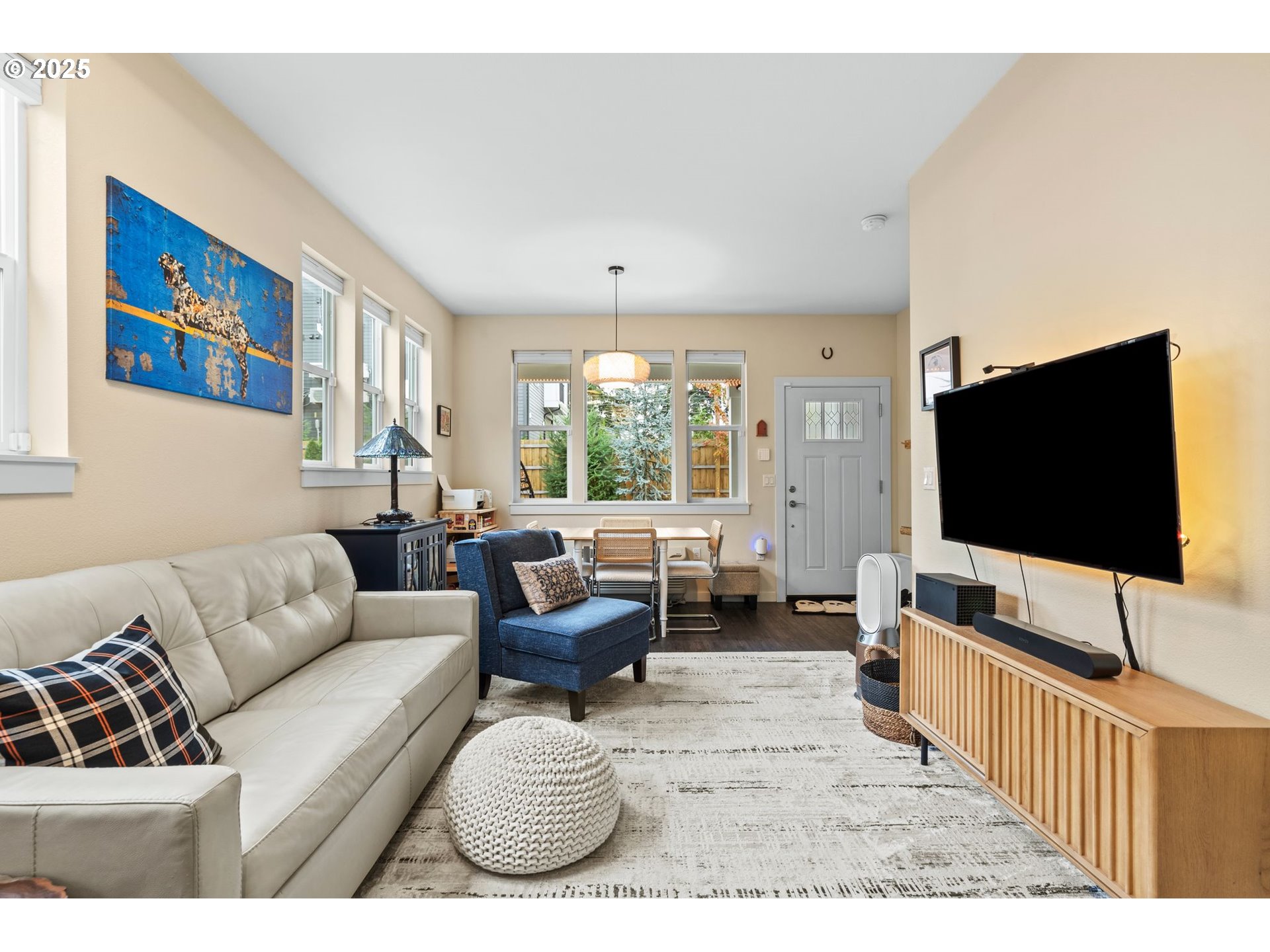 116 Northeast 109th Avenue, Unit A5 Portland, OR 97220 - Photo 12 of 46 a living room with furniture and a flat screen tv