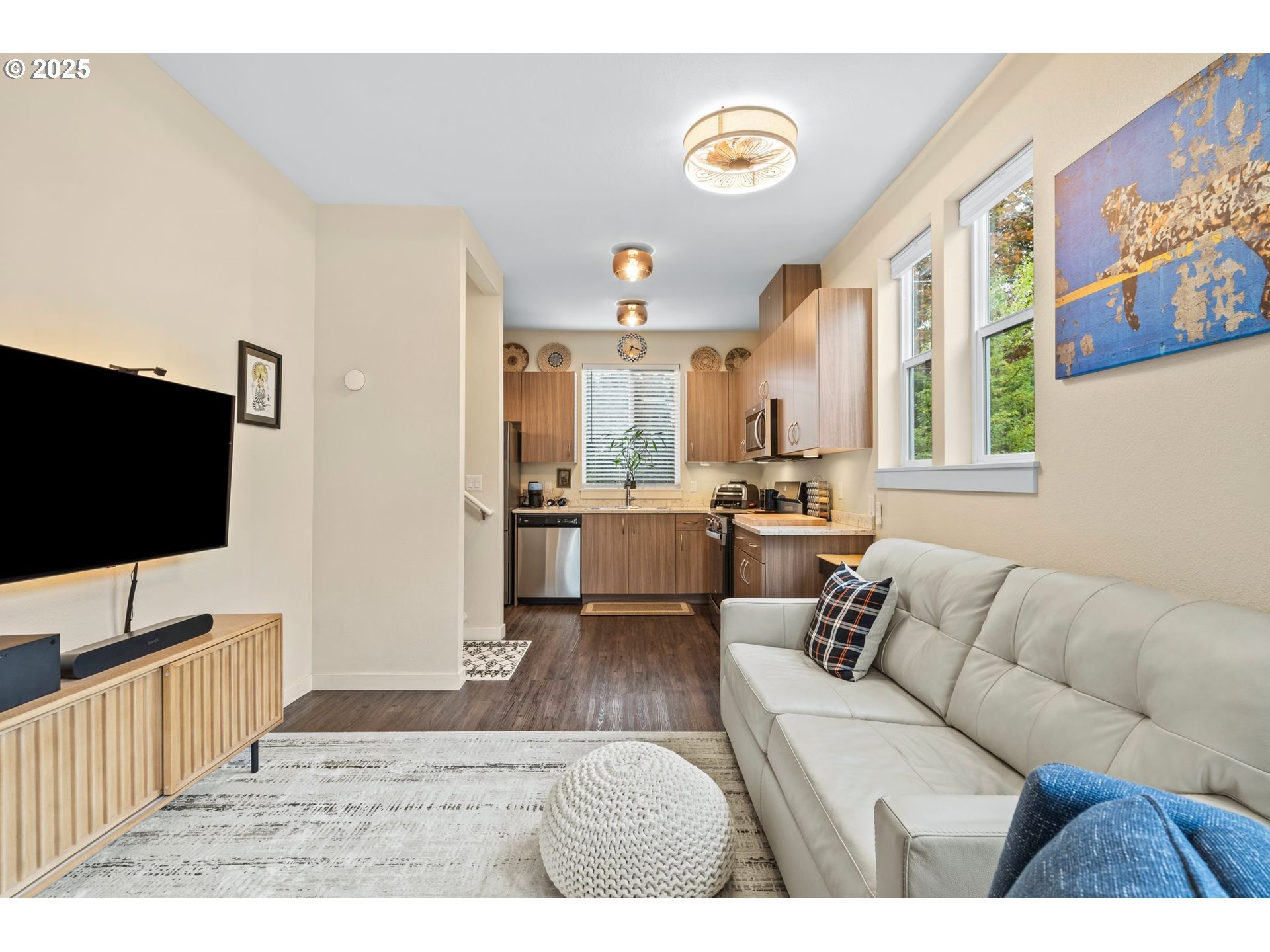 116 Northeast 109th Avenue, Unit A5 Portland, OR 97220 - Photo 13 of 46 a living room with furniture and a flat screen tv