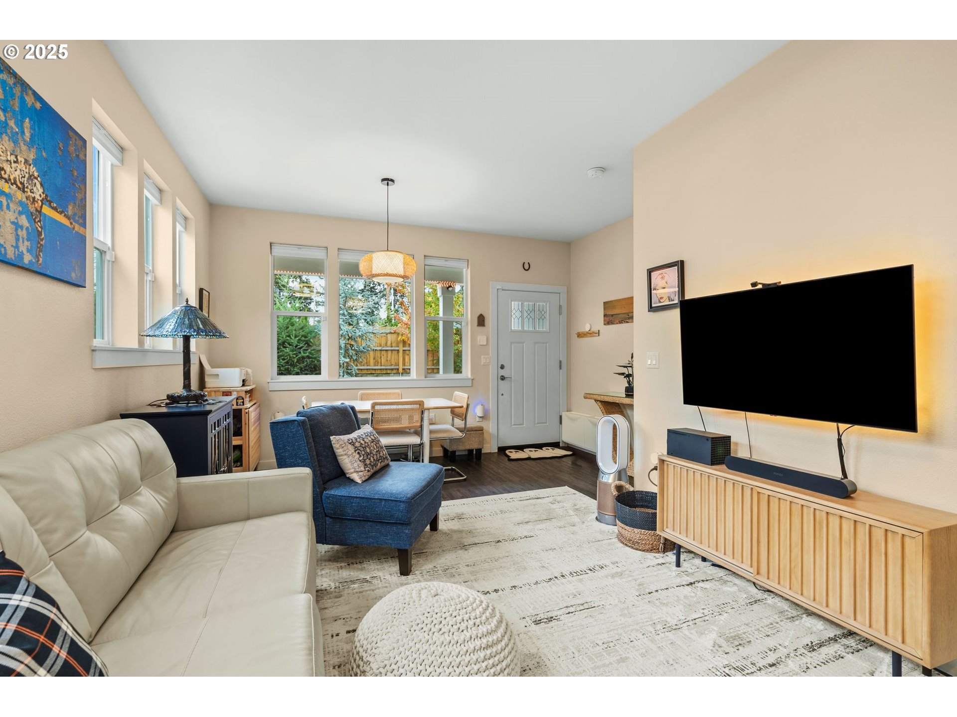 116 Northeast 109th Avenue, Unit A5 Portland, OR 97220 - Photo 14 of 46 a living room with furniture and a flat screen tv