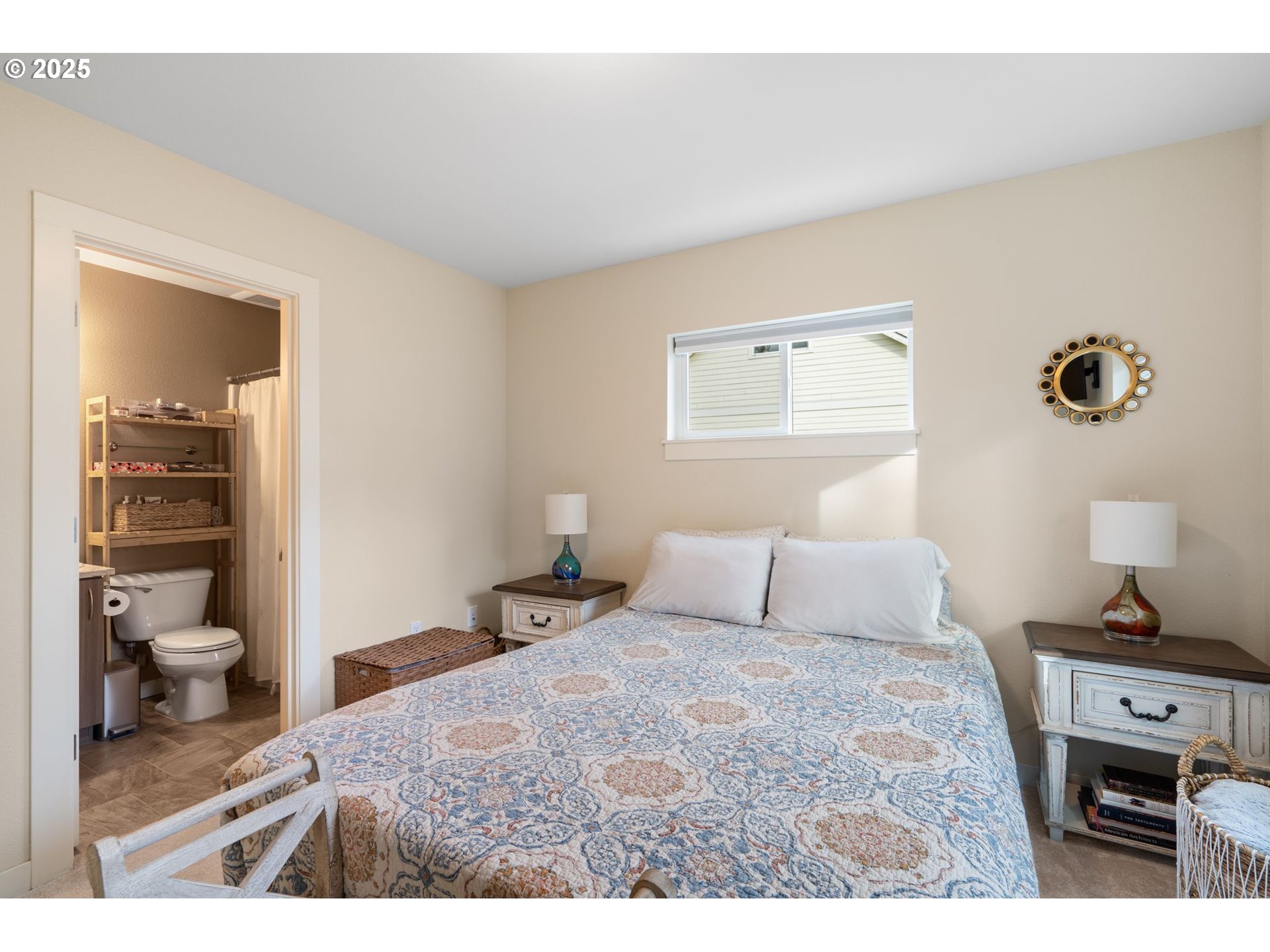116 Northeast 109th Avenue, Unit A5 Portland, OR 97220 - Photo 26 of 46 a bedroom with a bed and a view of bathroom