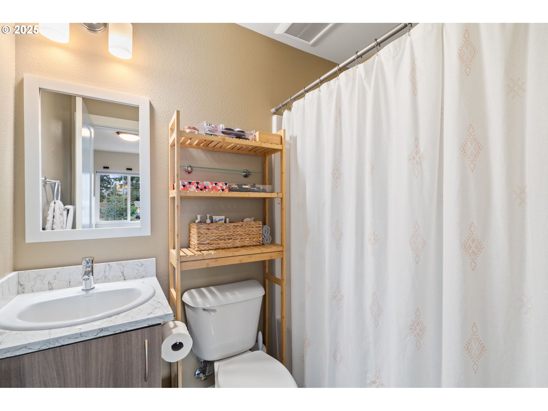 116 Northeast 109th Avenue, Unit A5 Portland, OR 97220 - Photo 31 of 46 a bathroom with a sink a toilet and shower curtain