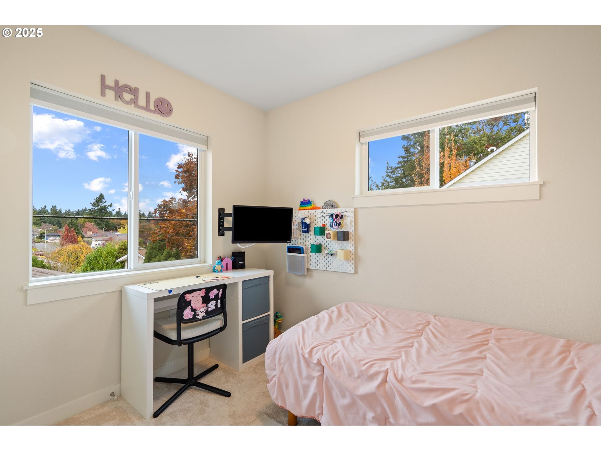 116 Northeast 109th Avenue, Unit A5 Portland, OR 97220 - Photo 33 of 46 a bedroom with a bed and a window