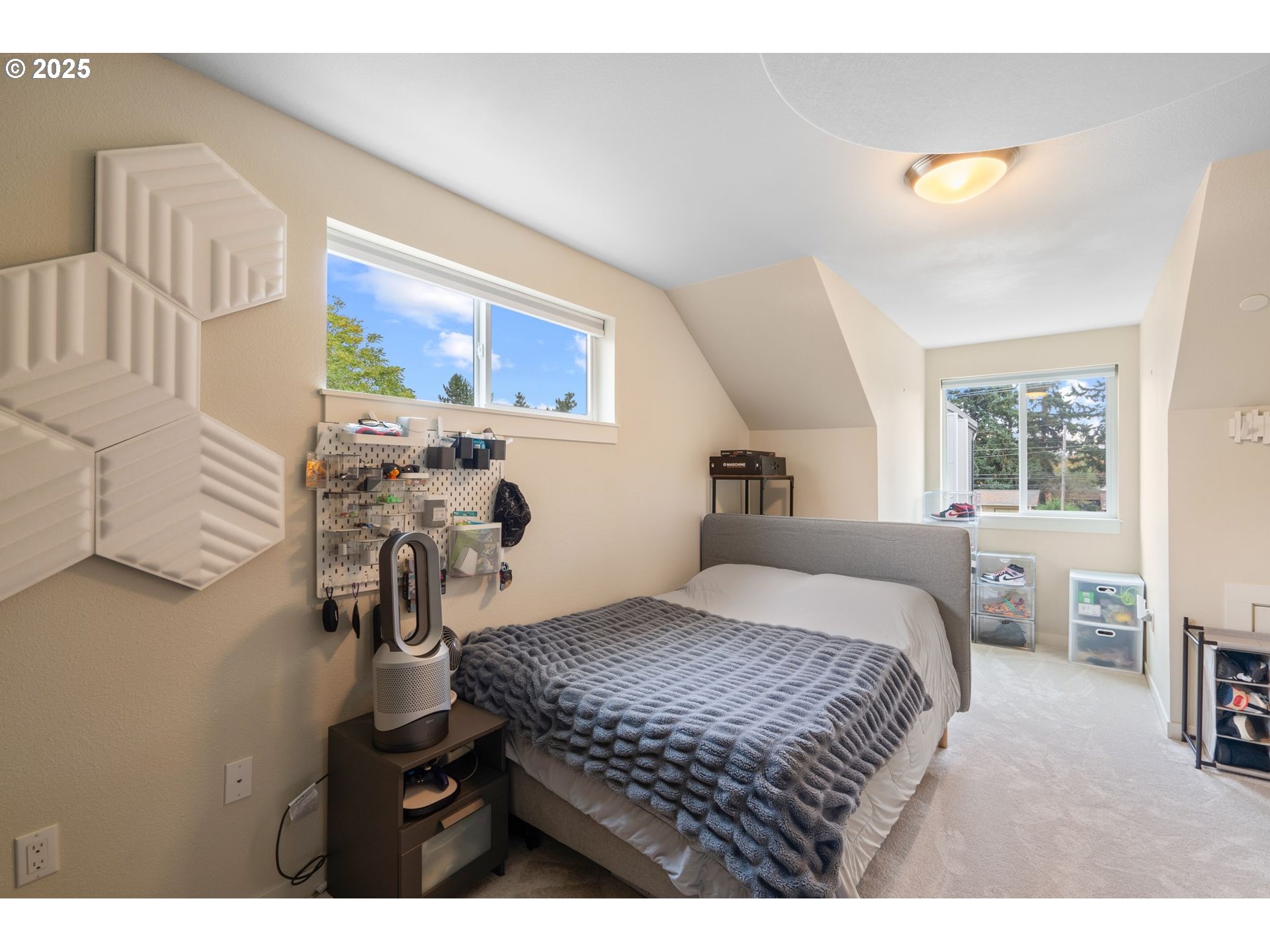 116 Northeast 109th Avenue, Unit A5 Portland, OR 97220 - Photo 39 of 46 a bedroom with a bed and dresser with mirror