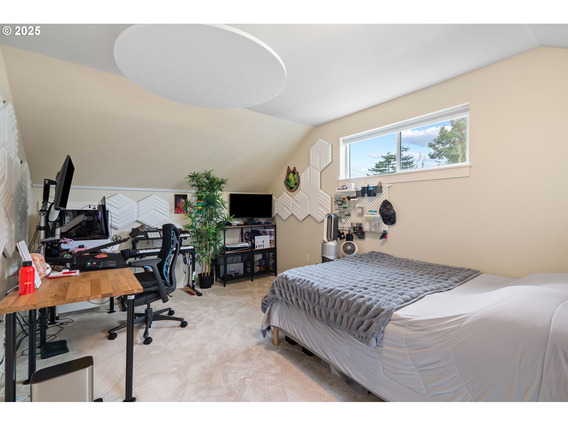 116 Northeast 109th Avenue, Unit A5 Portland, OR 97220 - Photo 42 of 46 a bedroom with a bed a desk and chair