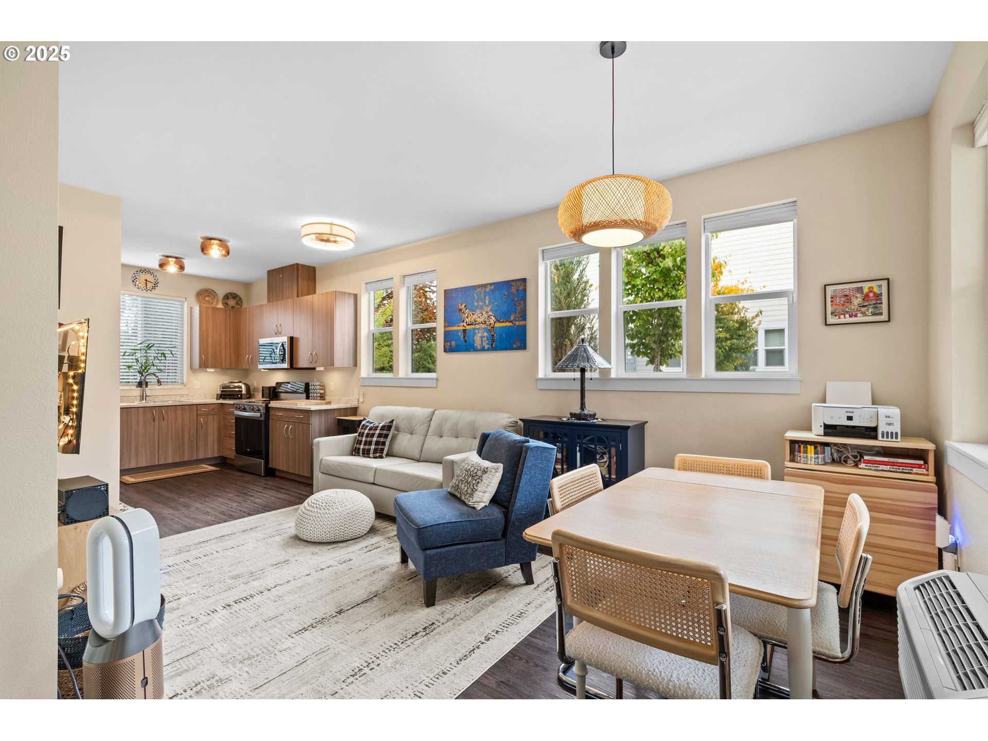 116 Northeast 109th Avenue, Unit A5 Portland, OR 97220 - Photo 6 of 46 a outdoor space with lots of furniture and a chandelier