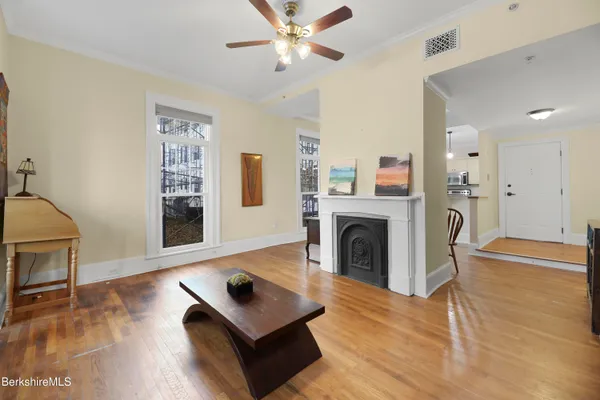 a living room with furniture and a fireplace