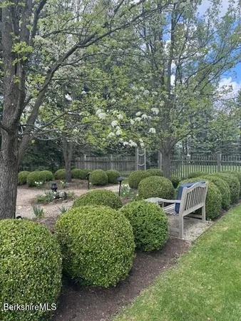 a view of a garden with outdoor seating