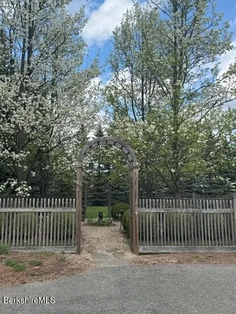 a view of a bench in the backyard