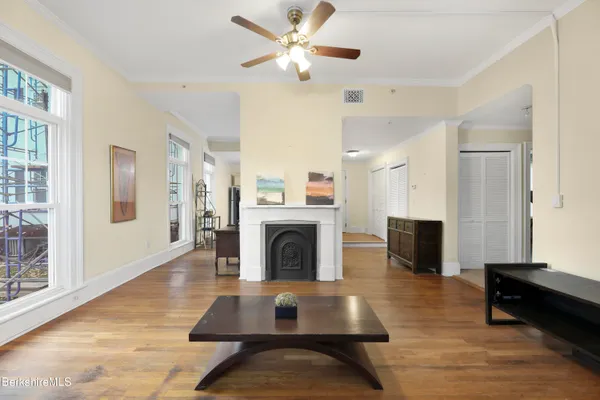 a living room with furniture fireplace and window
