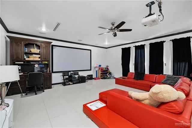 a living room with furniture a projector and a flat screen tv