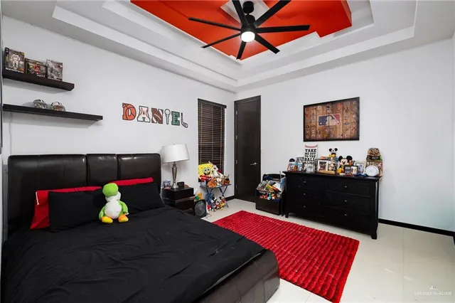 a living room with furniture flowerpot and a flat screen tv