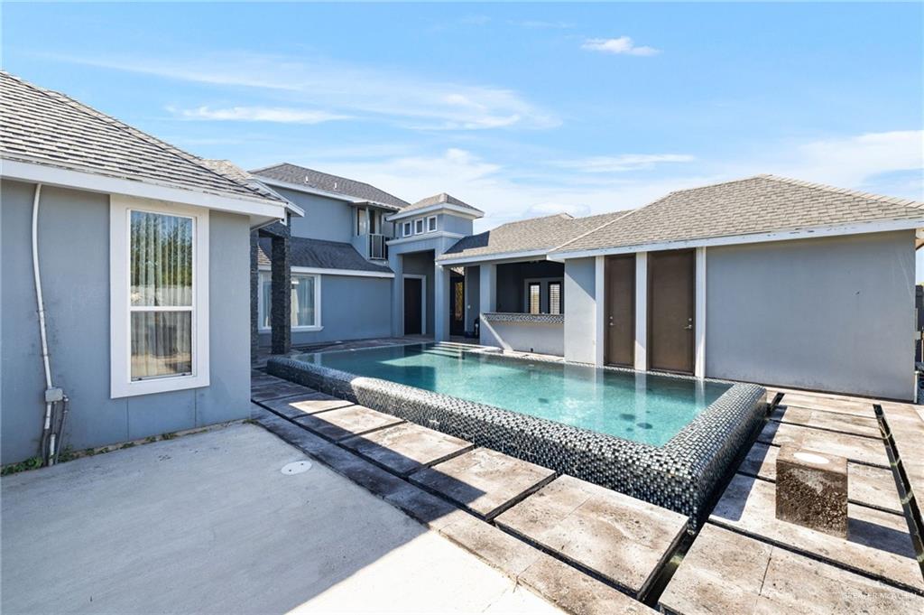 3011 Rio San Juan Street Rio Grande City, TX 78582 - Photo 21 of 31 a view of a house with swimming pool and porch