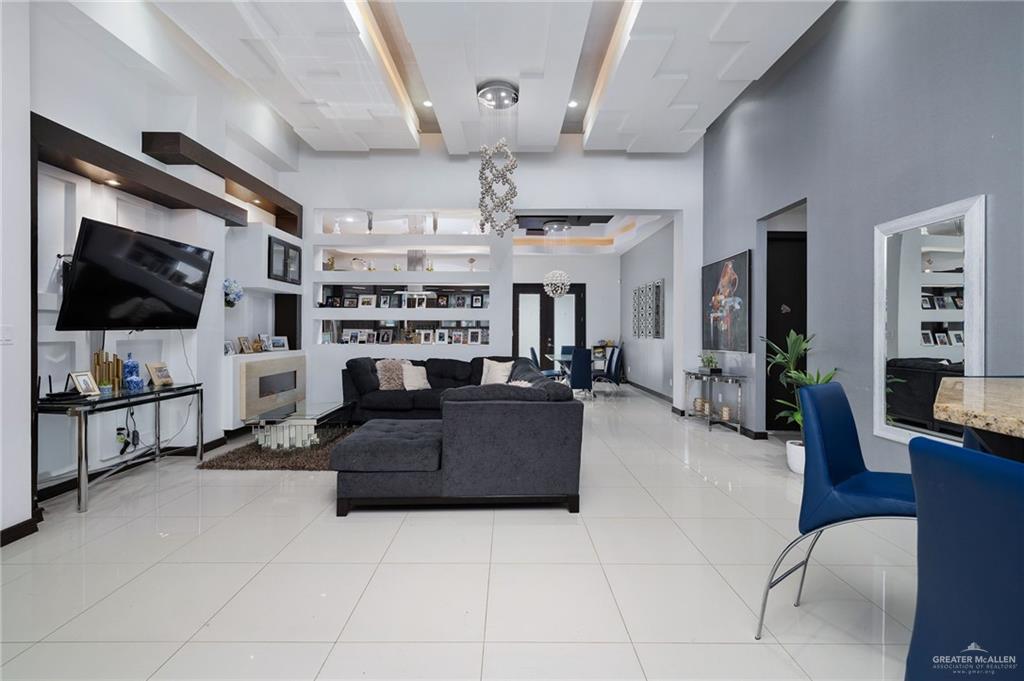 3011 Rio San Juan Street Rio Grande City, TX 78582 - Photo 10 of 31 a living room with furniture and a flat screen tv
