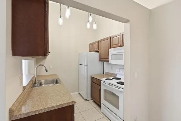 a kitchen with a sink a cabinets and window