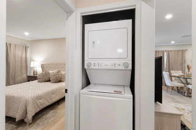 a bedroom with a bed and a mirror