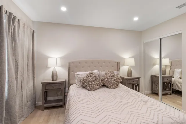 a bedroom with a bed and a closet