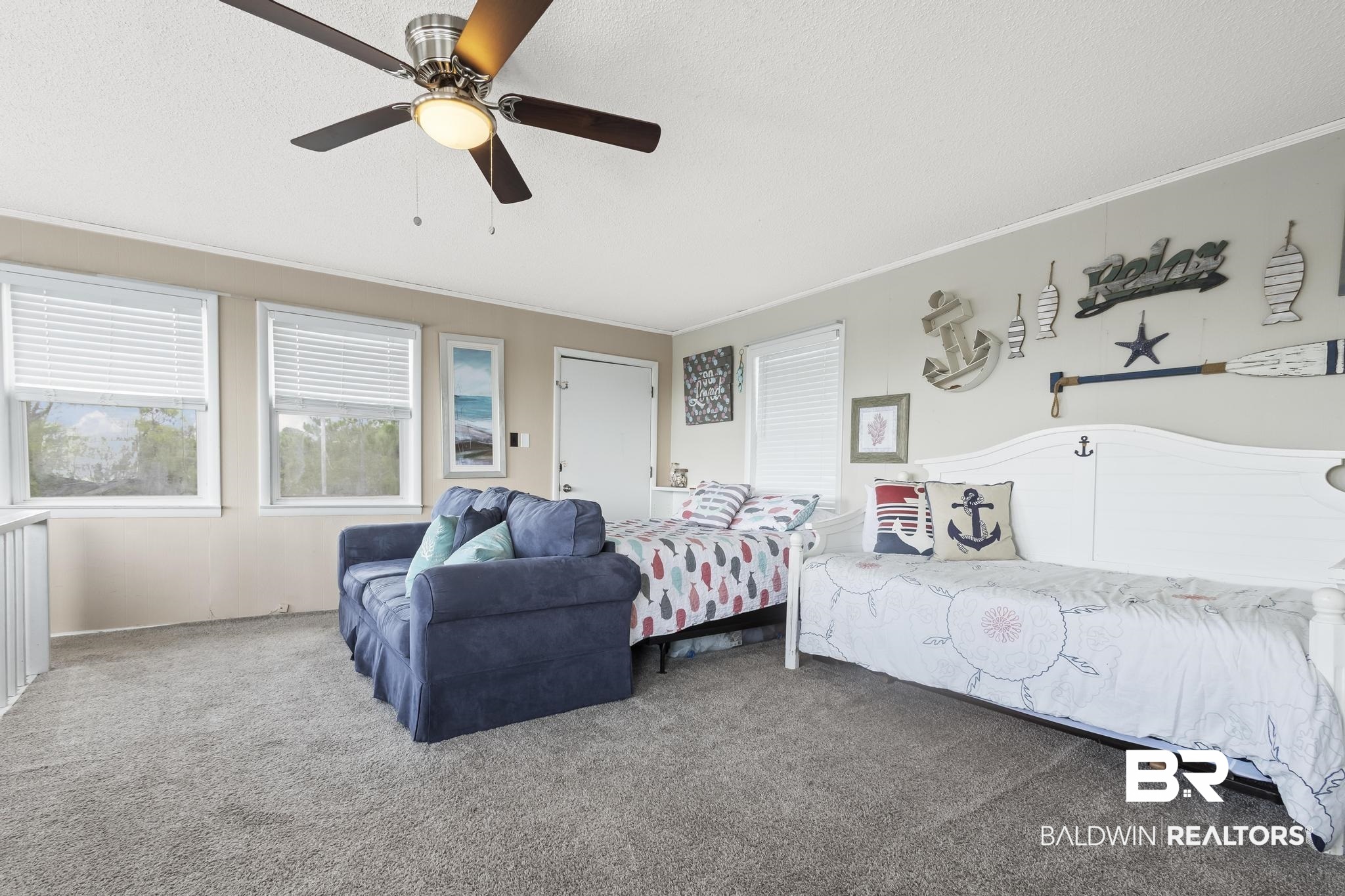 562 Veterans Road Gulf Shores, AL 36542 - Photo 25 of 32 Bedroom with carpet, a textured ceiling, ornamental molding, and ceiling fan