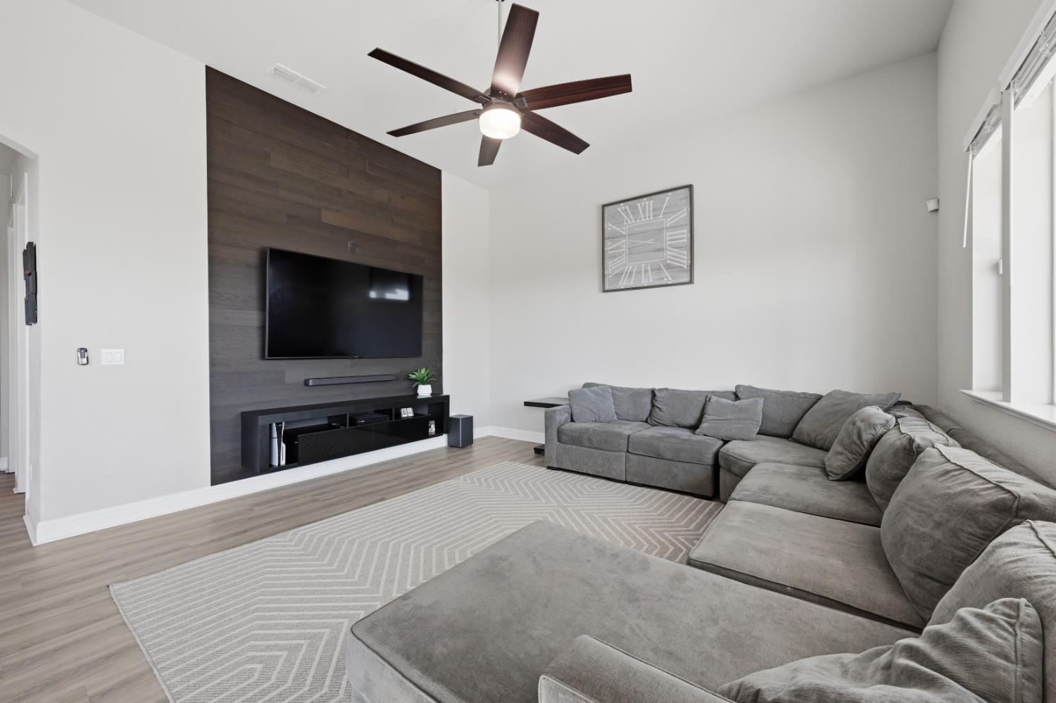 2012 Van Ruiten Drive Lodi, CA 95242 - Photo 17 of 49 a living room with furniture and a flat screen tv