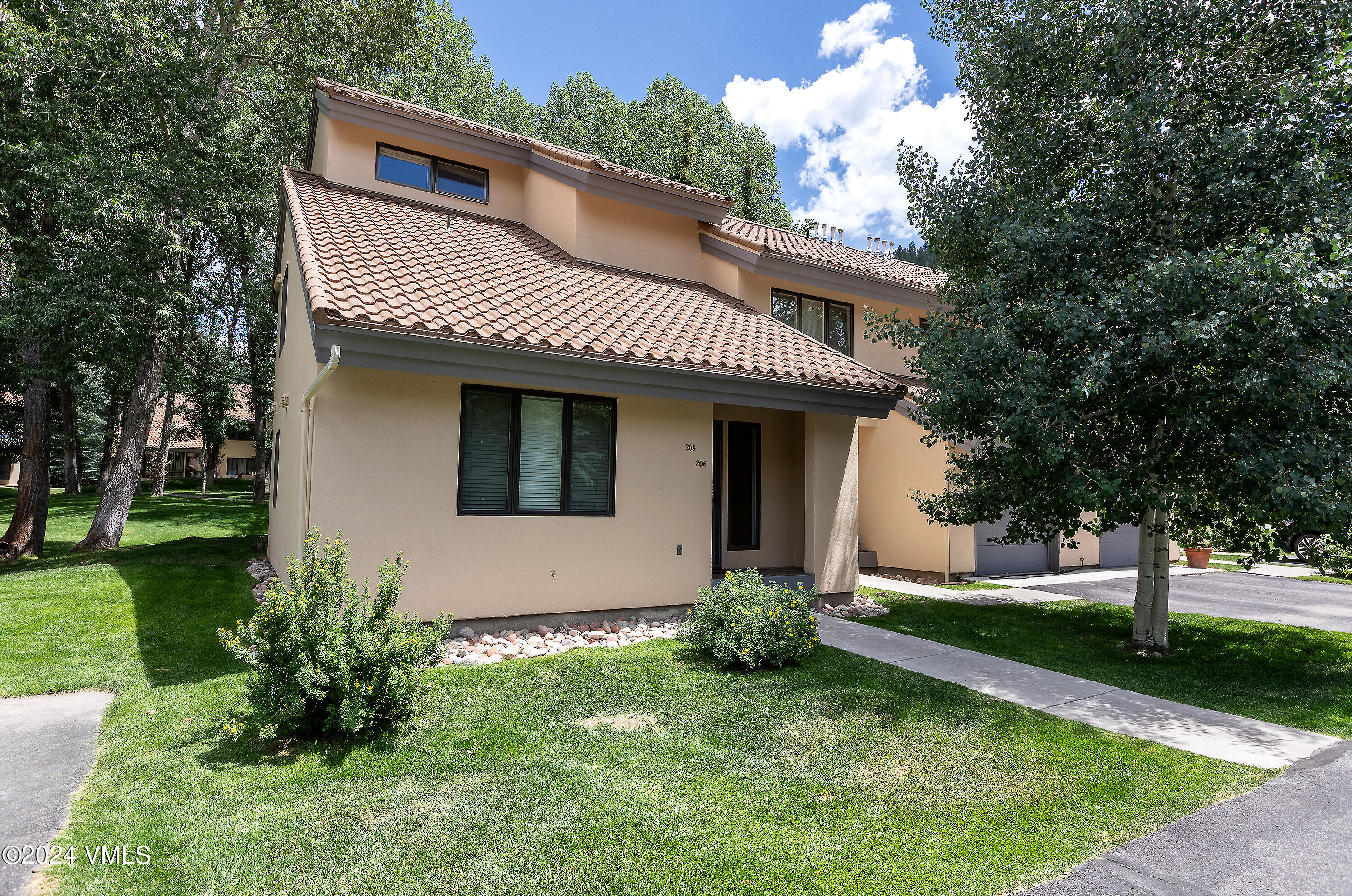 264 Eagle Drive, Unit 206 Eagle-Vail, CO 81620 - Photo 4 of 12 a view of a house with a yard