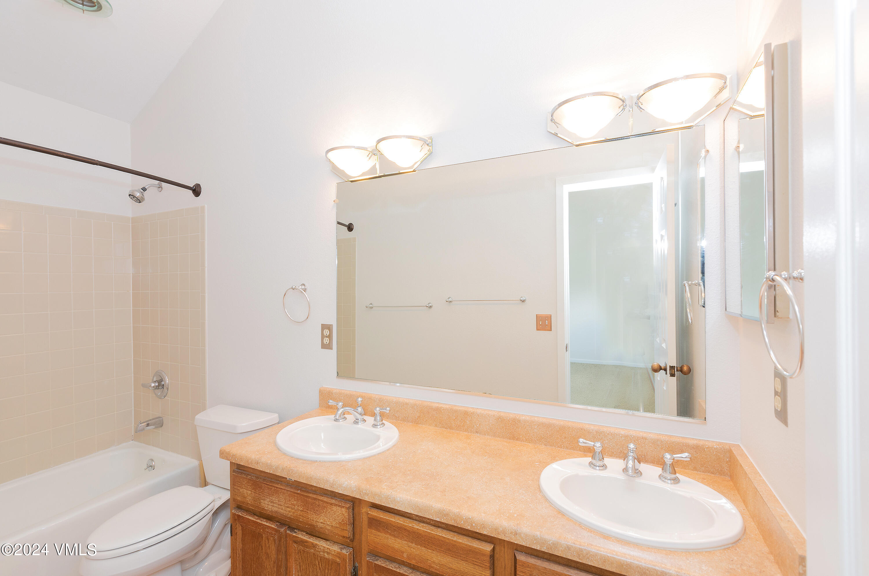 264 Eagle Drive, Unit 206 Eagle-Vail, CO 81620 - Photo 5 of 12 a bathroom with a granite countertop sink toilet a mirror and shower