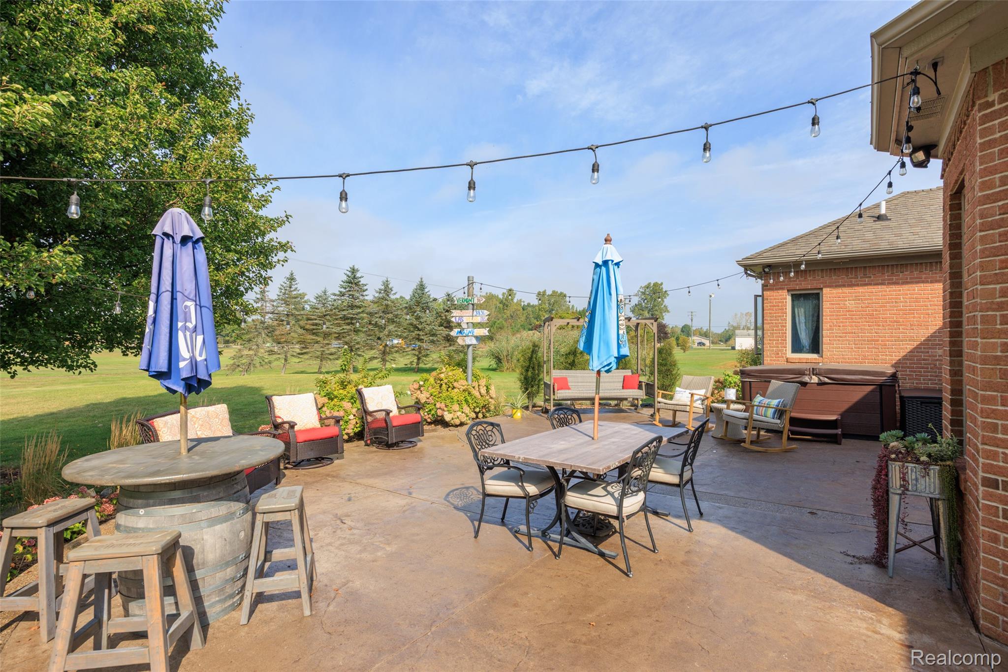 7030 Marsh Road Marine City, MI 48039 - Photo 35 of 47 View of patio / terrace with outdoor dining space and a hot tub