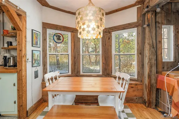 a view of a pool with lawn chairs