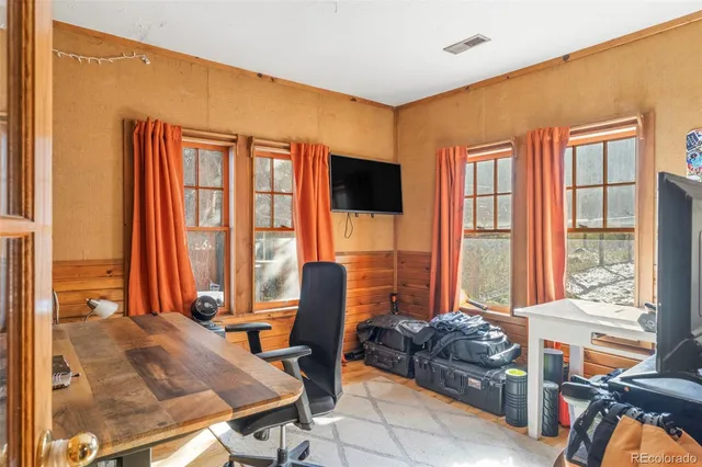 a room with furniture and a book shelf