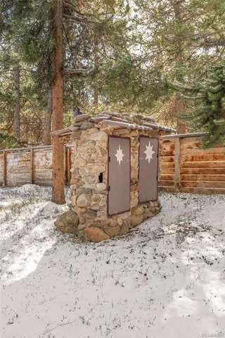 a view of a yard with wooden fence