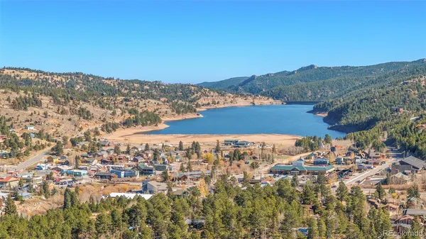 a view of a field of mountains and building