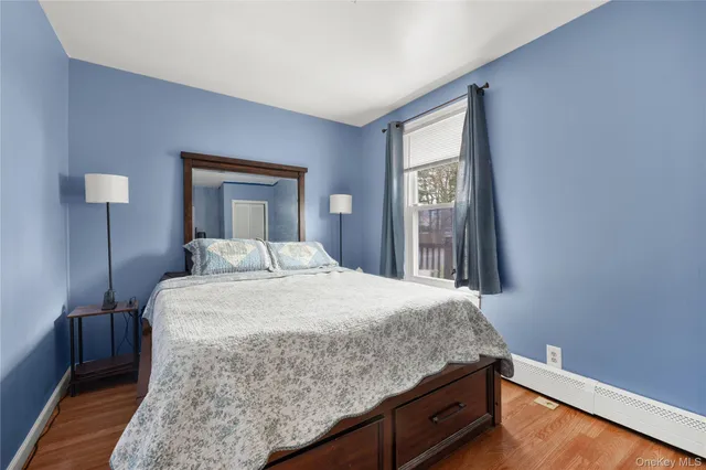 a bathroom with a toilet and a shower curtain