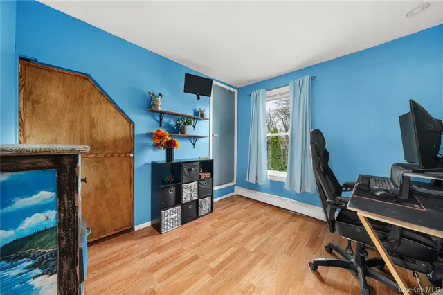 a kitchen with stainless steel appliances granite countertop a sink dishwasher a refrigerator and a stove with wooden floor