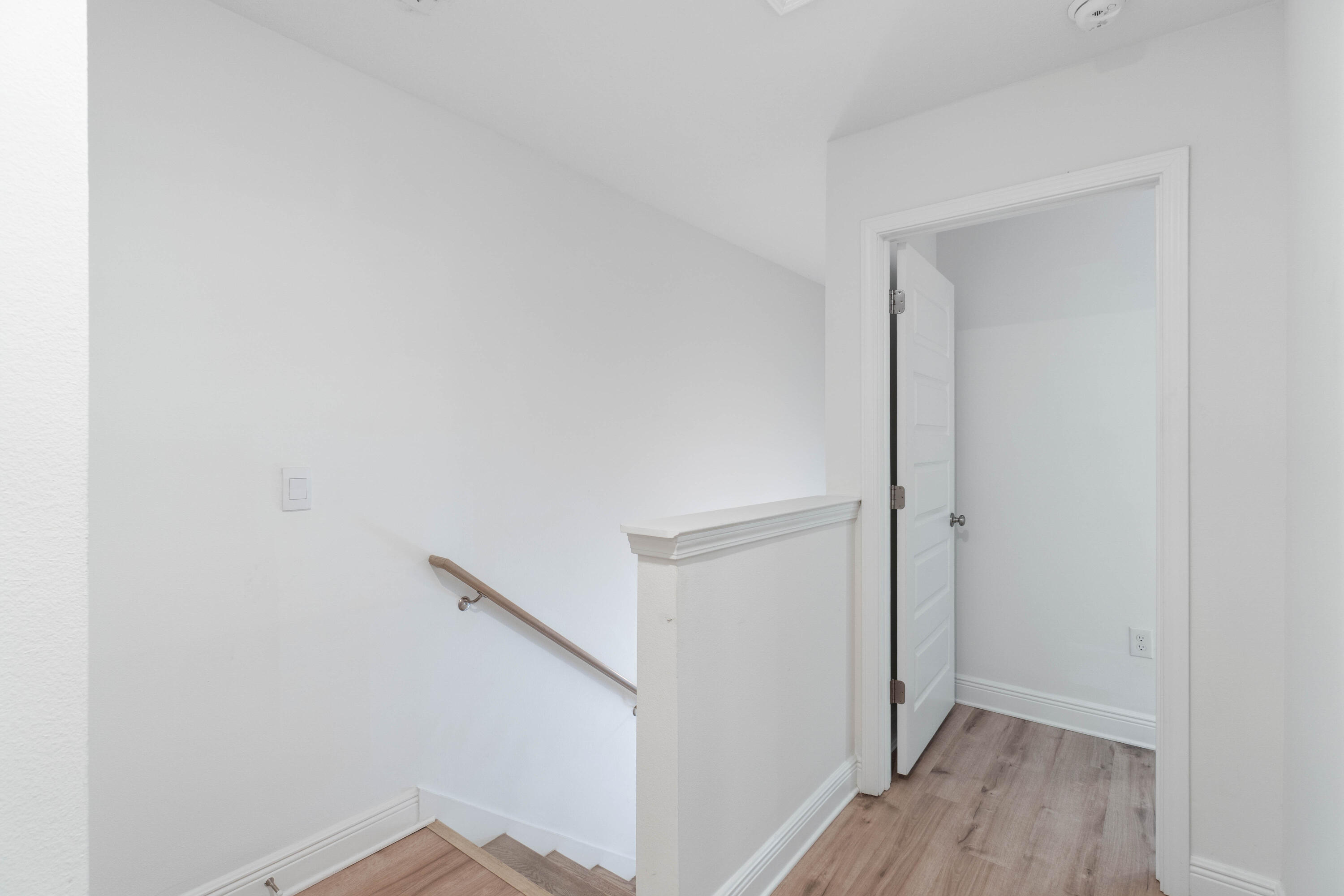 7 Renea Cove Destin, FL 32541 - Photo 12 of 36 a view of hallway with wooden floor