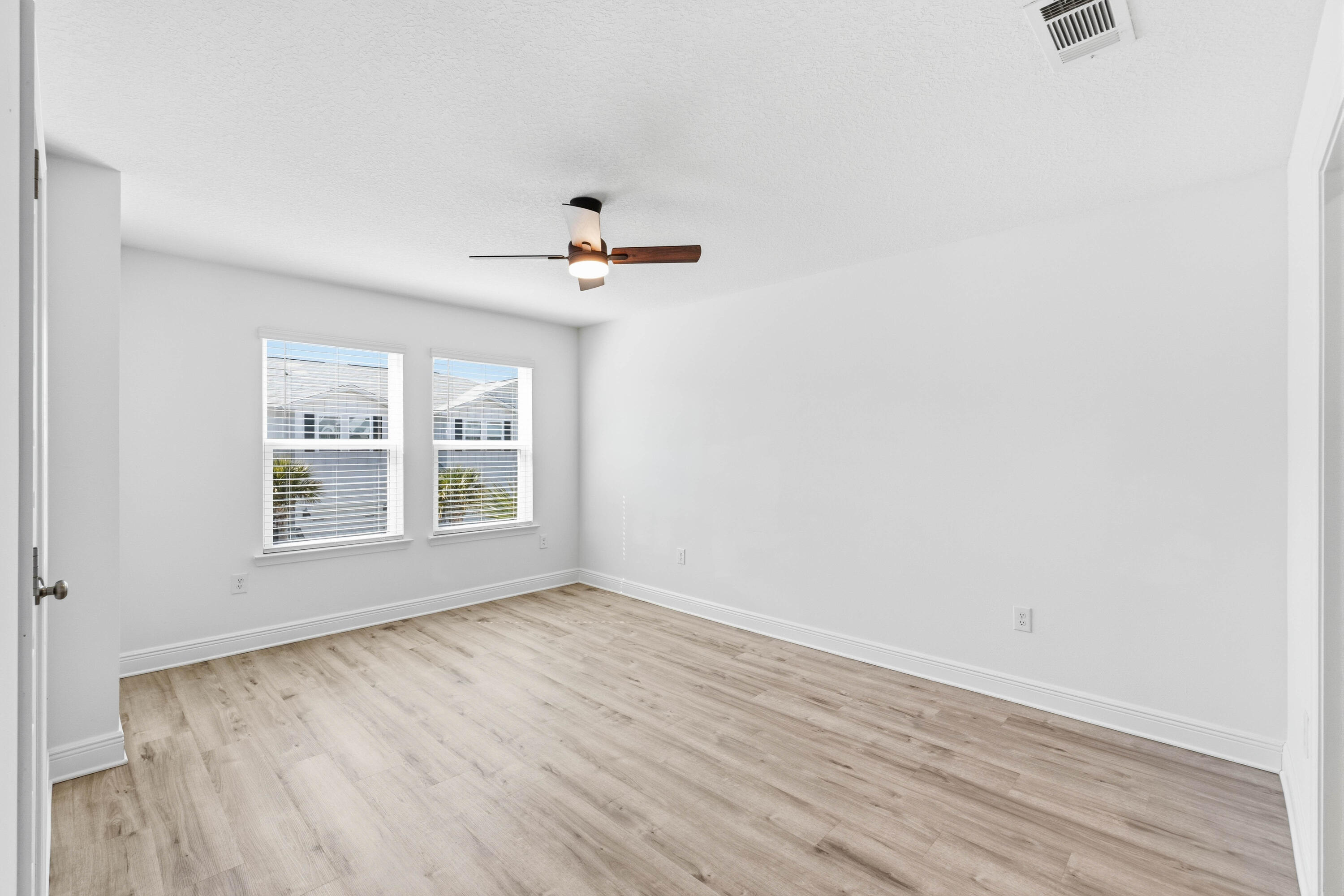 7 Renea Cove Destin, FL 32541 - Photo 13 of 36 wooden floor in an empty room with a window