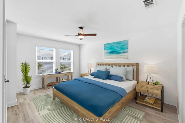 a bedroom with a bed running cycle and a window