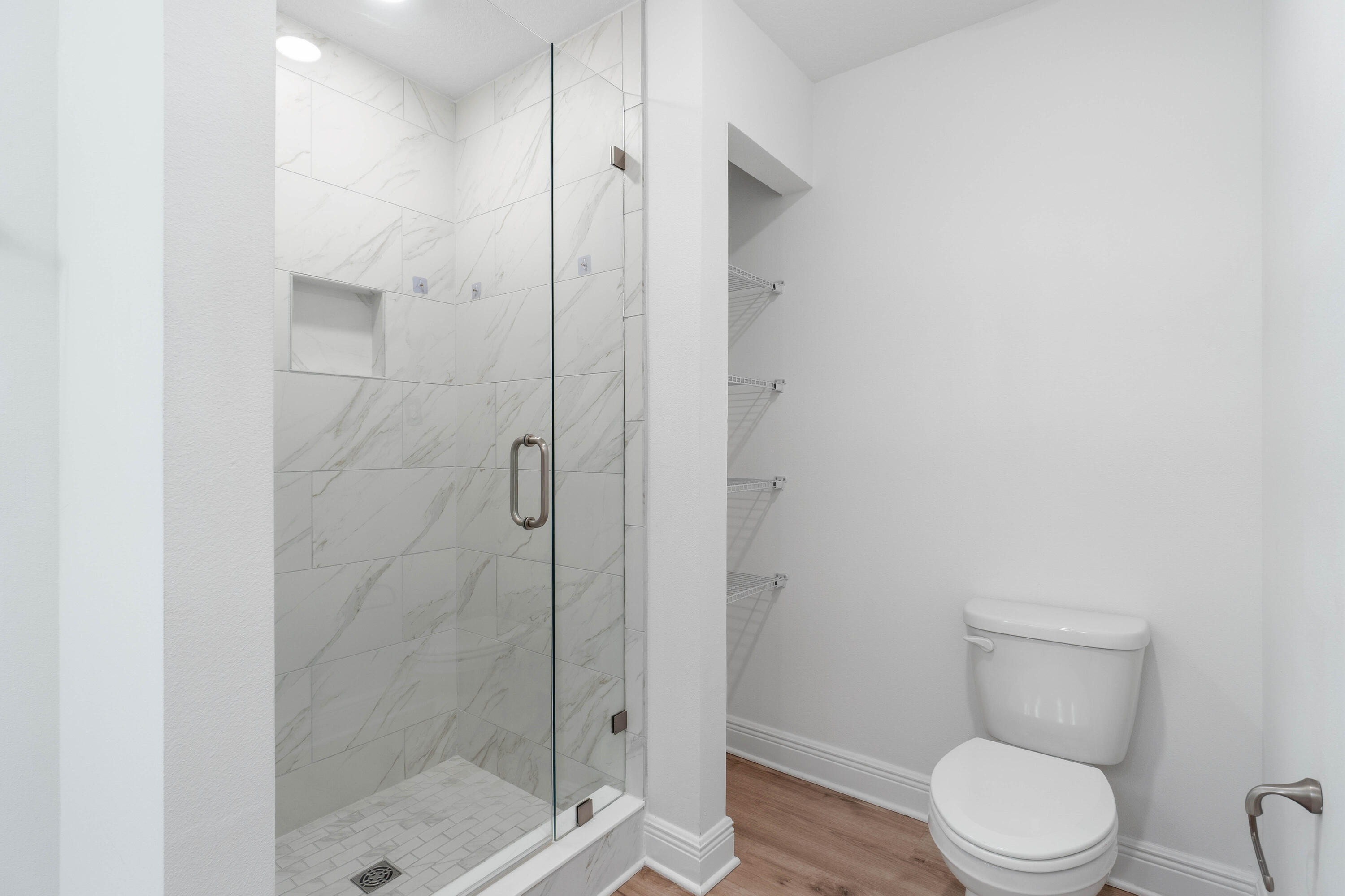 7 Renea Cove Destin, FL 32541 - Photo 24 of 36 a white toilet next to a bathroom