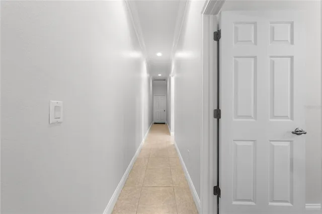 a bathroom with a granite countertop sink a toilet and a large mirror